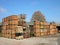 Lot of storage boxes with firewood in a factory at daytime