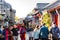 A lot of tourist at the walking street with taditional house and shops in park of Beihai North sea park, in the old town of