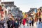 A lot of tourist at the walking street with taditional house and shops in park of Beihai North sea park, in the old town of