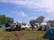 A lot of vacationers travelers has established a large tent camp outdoors travelers rest in the car Novosibirsk region summer