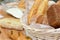 A lot variety breads in wicker basket on the table at commercial bakery kitchen