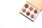A lot of variety chocolates in box on white wooden background