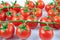 A lot of vine tomatoes (solanum lycopersicum) on white background