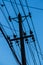 Lot wires pole Silhouette in the blue sky