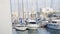 A lot of yachts in the port. Stock. Sailboat harbor, many beautiful moored sail yachts in the sea port, modern water