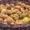 A lot of yellow different autumnal pumpkins in basket