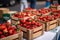 Lots of baskets with fresh ripe strawberries for sale at farmers market closeup. Strawberries in boxes, strawberry fruits in