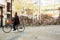 A lots of bicycles of people parked on parking area in downtown.