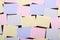 Lots of blank sticky notes on wall