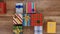 Lots of colorful wrapped presents gather on wooden surface