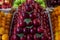 Lots of fruits on the fruit market counter.