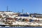 Lots of Inuit huts and colorful houses situated on the rocky coast along the fjord, Nuuk city, Greenland