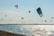 Lots of kites. Sea coast, in the coastal zone there are many extreme sports athletes