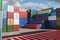 Lots of long cargo containers stacked at the terminal port for import export business. Logistics, unloading, loading, storage,