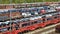 Lots of new cars loaded on railway autorack wagons ready for shipment