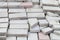 Lots of old paving tiles. Dismantled garden path. Selection focus. Shallow depth of field