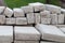 Lots of old paving tiles. Dismantled garden path. Selection focus. Shallow depth of field