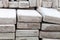 Lots of old paving tiles. Dismantled garden path. Selection focus. Shallow depth of field