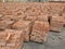 Lots of pallets of bricks. Pallets of new concrete blocks on an outdoor warehouse