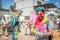 The lots of people in the color fest, colored faces of the peoples, color festival in india