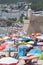 Lots of people enjoying a wonderful day at the beach in Sesimbra, Portugal