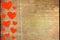 Lots of red hearts on dark brown rustic weathered wooden background, top view