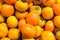 Lots of ripe delicious persimmons for eating a background