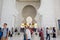 Lots of tourists visiting the Grand Mosque built with marble stone, also called Sheikh Zayed Grand Mosque in the Abu Dhabi, United