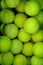 Lots of vibrant green tennis ball pattern background