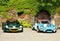 Lotus Elise and Renault Alpine in front of the cas
