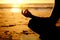 Lotus, yoga and hands silhouette at beach outdoors for health, wellness and fitness. Sunset, zen meditation and shadow