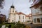 Loucen Rococo castle surrounded by a vast English park, Romantic baroque chateau with Church of the Assumption of the Virgin Mary