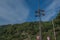 Loudspeakers broadcast tower with a blue sky and Mountain background .