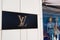 Louis vuitton logo brand and sign text front entrance up store fashion shop in street view