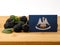 Louisiana flag on a wooden panel with blackberries isolated on a