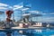 lounge area with pool and sofa, glass pavilion and a view of the summer landscape with clear blue sky