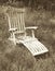 Lounge chair in field textured in vintage style.