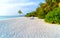 Lounge chairs on a beautiful tropical beach at Maldives