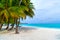 Lounge chairs on a beautiful tropical beach at Maldives