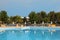 Loungers and parasol standing near to the pool