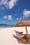 Loungers and parasol on a tropical beach, Isle of Pines