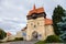 Louny, Czech Republic, 19 September 2021: Zatec Gate with wall and prismatic bastions, medieval fortification complex with wooden