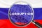 Loupe focused on the word corruption on Russia flag background. Corruption, financial concept in Russia