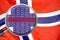 Loupe focused on the word inflation on Norway flag background. Inflation, tax, financial concept in Norway