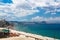 Loutraki embankment in the morning. Aegean sea shore and city beach