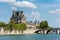 The Louvre Museum  and brige across the Seine Rive, the world`s largest art museum and a historic monument in Paris, France. A