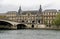 Louvre museum building on Seine river embankment near Pont du Carrousel bridge in central Paris