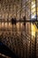 The Louvre Palace and the pyramid by night as entrance inside Louvre Museum, tourists sightseeing, taking pictures