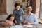 Lovable family posing near the table in living room