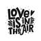 Love is in the air vector black lettering clip art isolated on white background. Handwritten poster or greeting card.